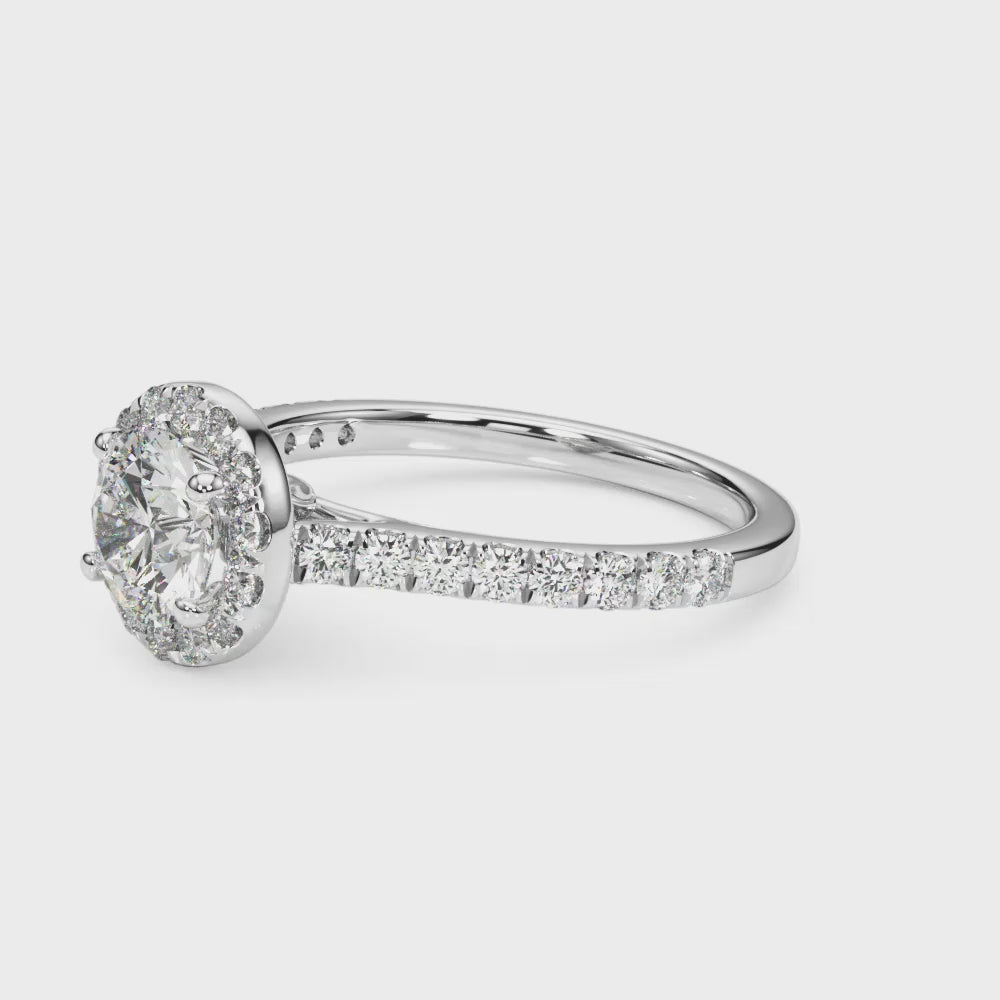 Round Halo with Hidden Accent engagement ring on hand, video 1